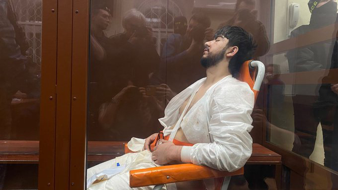 PHOTO Muhammadsobir Fayzov wheeled in on a stretcher to court