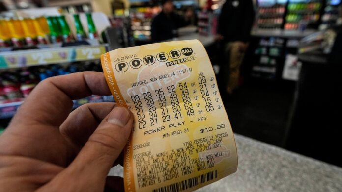 Powerball jackpot reaches $1.23B as long odds mean lots of losing, just as designed
